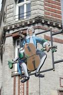 musician in a wig as an advertisement on a Shield