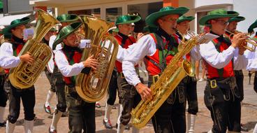 musicians with saxophones and trombones on the streets of south tyrol