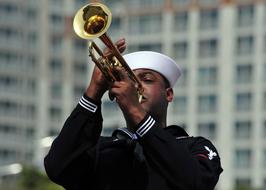 sailor with wind musical instrument