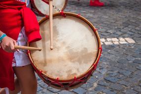 girl playing drum outdoor