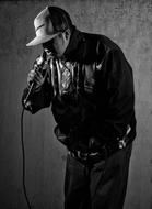 black and white photo of a rapper in a leather jacket