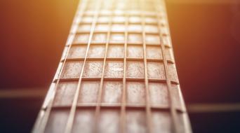 close up of guitar strings in bright light