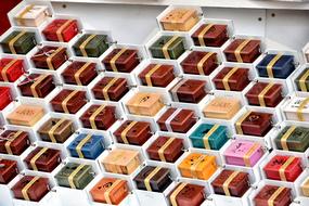 multicolored music boxes at the christmas market