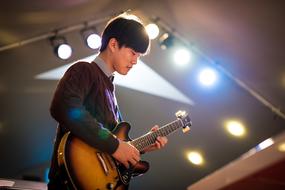 Asian musician with a guitar