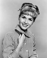 Black and white photo, with the portrait of the beautiful, smiling Debbie Reynolds