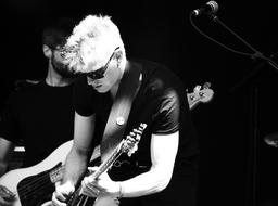 musician with guitar in black and white background