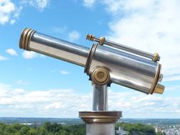 vintage coin Telescope at scenic landscape