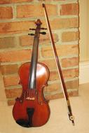 standing violin with bow