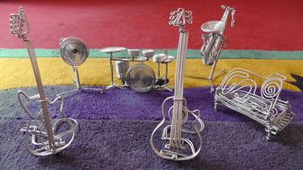 metal decoration in the form of musical instruments