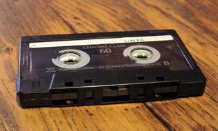 vintage Audio Cassette on wooden background
