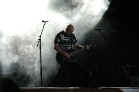 bass guitarist on stage in the haze
