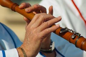 woman fingers on flute