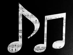 two musical notes on a black background