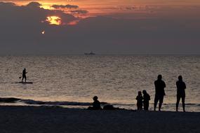 people on Holiday on a sea in the Evening