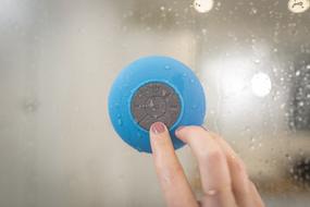 Blue Bluetooth Speaker hand
