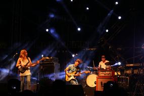 music group in the spotlight on stage