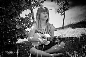 monochrome photo of Person Human Child playing on guitar