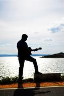 Guitarist Silhouette Sunset sea