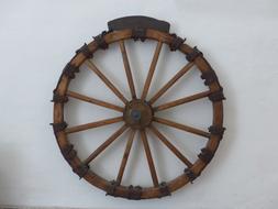 old wooden wagon wheel on the wall