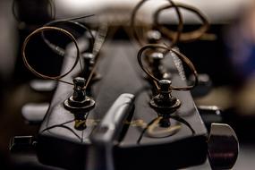 the iron strings of a guitar