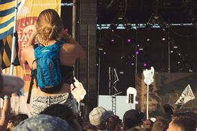 people at a concert near the stage