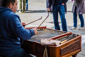 street performer playing cimbalom