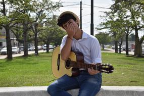 young guitarist outdoor