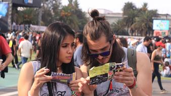 two young friends with flyers