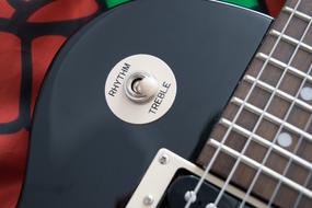 switch on black electric guitar
