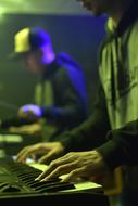photo of hands on piano Keyboards