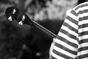 Black and white photo of the person with banjo
