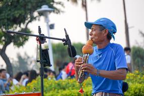 street musician with Hulusi