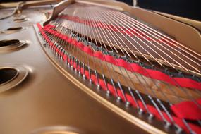 strings of a concert grand piano close up