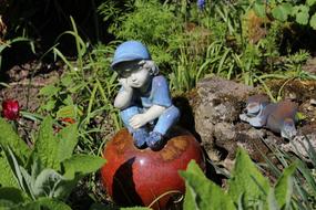 Ceramic Garden decoration, thoughtful little boy