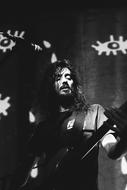 long hair young man on stage, live music Concert