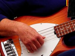 Music, male hand on strings of Guitar