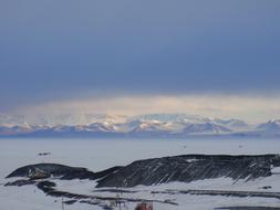 Royal Society Range, scenic mountains at ice covered sea in antarctica
