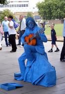 blue living statue with guitar