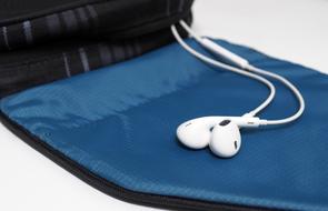 white Headphones on blue Bag