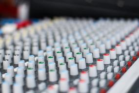 control panel of Electronic Sound Mixer close-up on blurred background