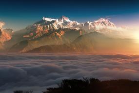 Mountain summits above Clouds at sunset, gorgeous landscape