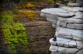 Girl Solitude Meditation on rock