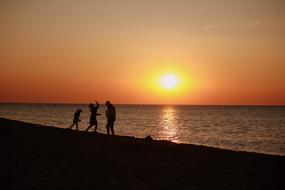 people at Sunset Sea Baltic