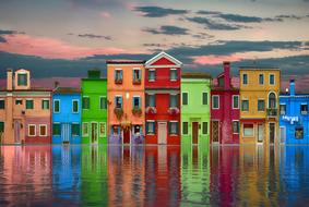 graphic image of colorful houses on the shore of a reservoir