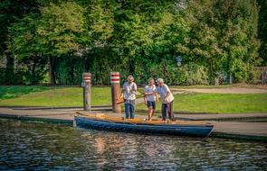 women on the shore near the boat