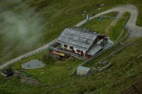 view from a height of a house along a winding road in the mountains