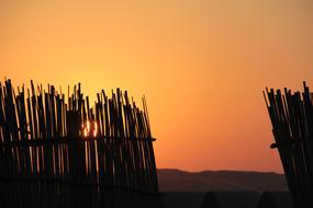 wooden fence at sunset sky