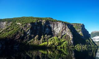 scenic green rocks and lake