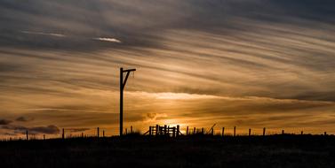 photo of a gallows at sunset in Northumberlain, England