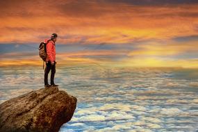 Landscape of man on rock Mountain and Sky at sunset